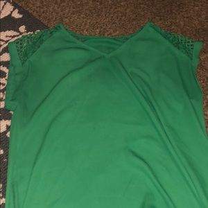Green blouse. No tag, but fits a small/medium!